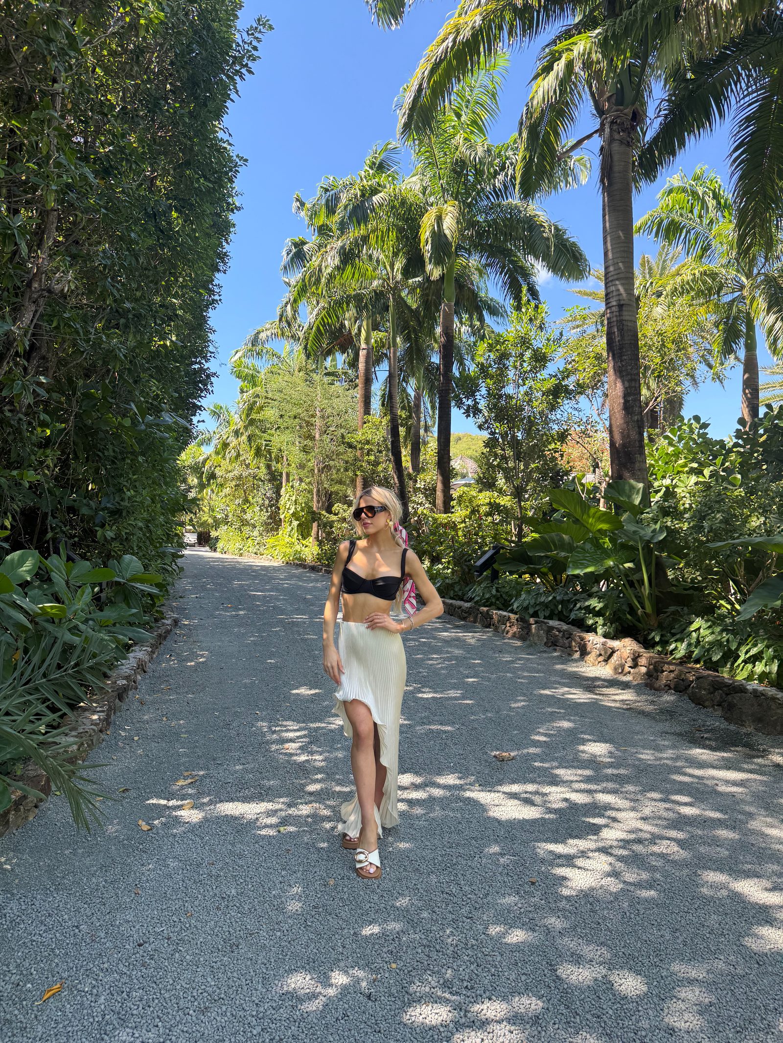 Brooke on a palm-lined walk